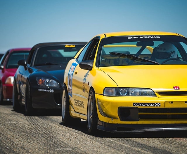 A photo of a line of race cares at Willow Spriings.